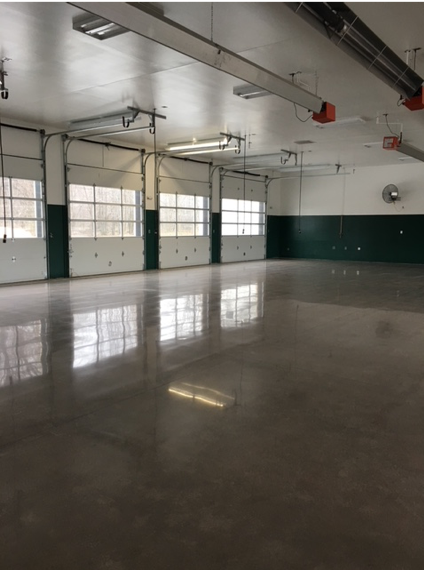 A brown polished concrete floor in a garage.