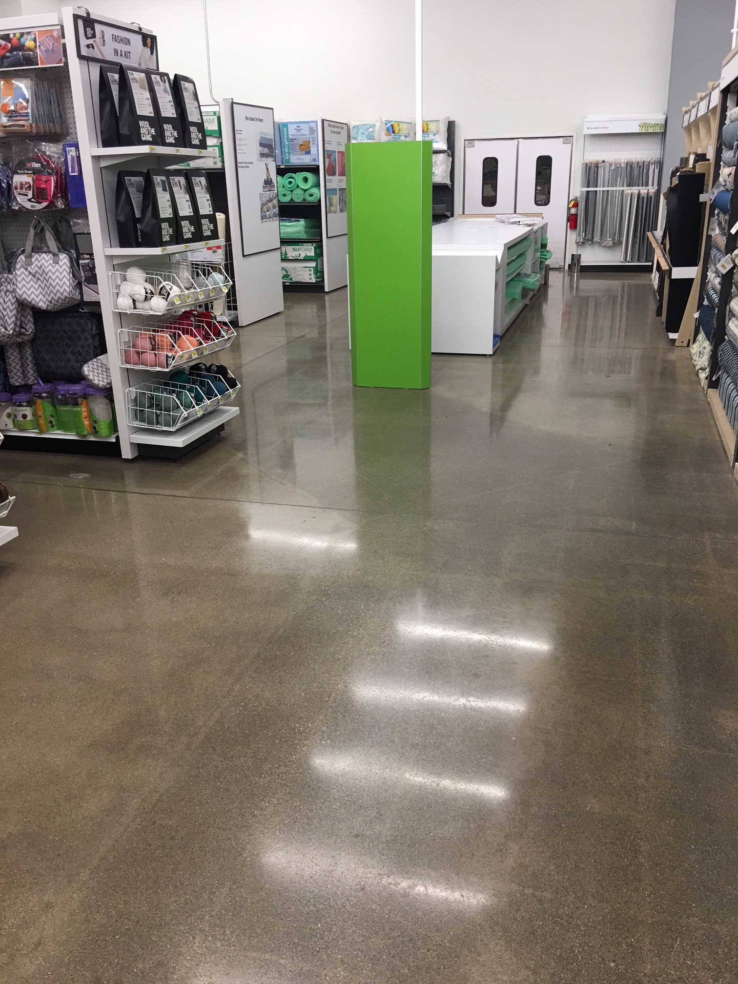 A brown polished concrete floor in a store.